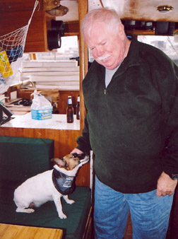 Jimmy Harold on his boat with Daisy.